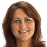 Headshot of a person with medium-length brown hair wearing a red top, set against a plain white background.